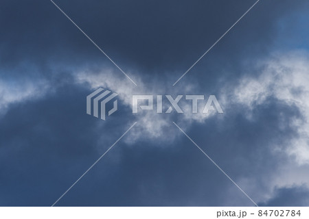 Gray overcast cloudy sky over horizon. Closeup clouds 84702784