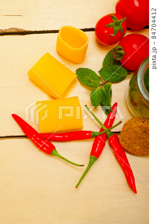 Italian pasta paccheri with tomato mint and chili pepper 84704412