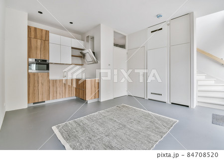 Light room with a small kitchen area Light room with a small kitchen area 84708520