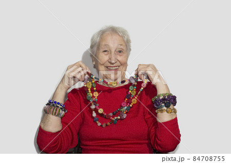 Senior woman and jewelry pearl Senior woman and jewelry pearl 84708755