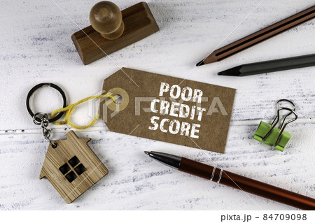 Poor credit score. Cardboard price tag on office desk Poor credit score. Cardboard price tag on office desk 84709098