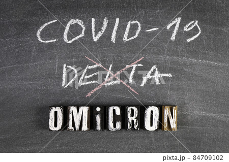 Covid-19 Delta and new Omicron. Black chalk board 84709102