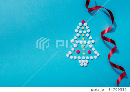 Creative Christmas tree made of pills, holiday greeting card with space for text 84709532