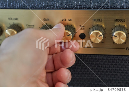 Guitar amplifier closeup, cable connected 84709858