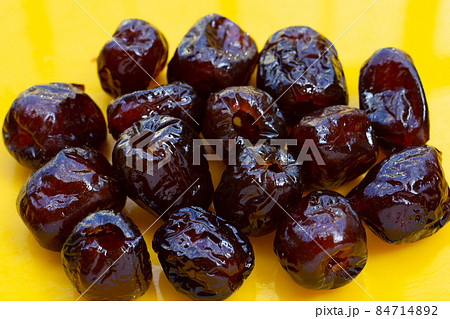 Sweet chinese jujube dessert on yellow background. 84714892