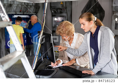 Positively minded family together solve puzzles in a quest room in form of an abandoned laboratory Positively minded family together solve puzzles in a quest room in form of an abandoned laboratory 84716123