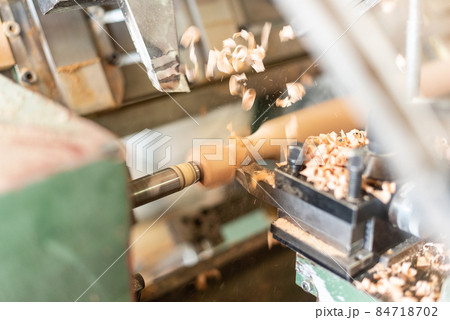 scraping wood turning a wooden baluster, horizontal scraping wood turning a wooden baluster, horizontal 84718702