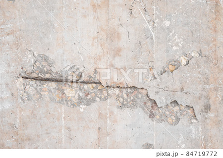 Textured grunge Beige pink background. Old wall with a peeling cover Textured grunge Beige pink background. Old wall with a peeling cover 84719772