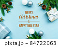 Christmas present and pine tree with xmas decoration on blue background 84722063