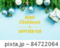 Christmas present and pine tree with xmas decoration on blue background 84722064