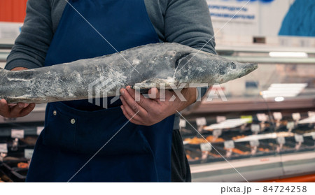 Male fishmonger or fish market worker 84724258