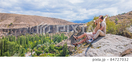 Happy couple on summer vacation in famous place. Cave formations. Happy couple on summer vacation in famous place. Cave formations. 84727032