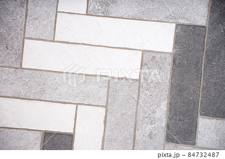Rectangular floor tiles in white and gray tones 84732487