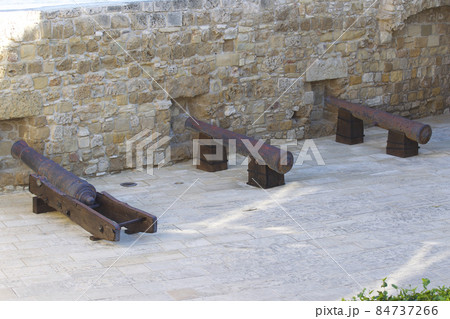 Ancient cannon weapon defense in an old fortress 84737266