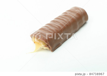 Tasty candy bar isolated on white background Tasty candy bar isolated on white background 84738967