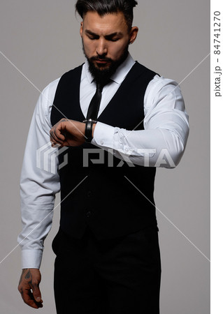 Man in elegant clothes on gray backdrop 84741270