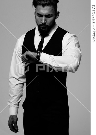 Man in elegant clothes on gray backdrop 84741273