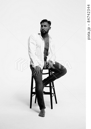 Muscular shirtless tattooed guy in studio Muscular shirtless tattooed guy in studio 84742344