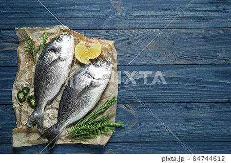 Flat lay composition with graphic drawing tablet and different office items on grey stone background 84744612