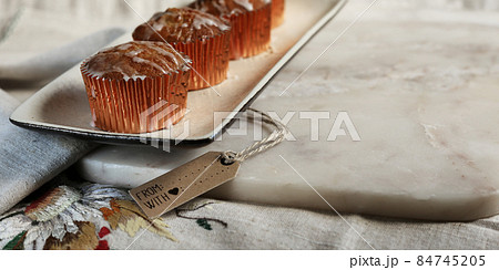 Sweet cakes on kitchen table 84745205