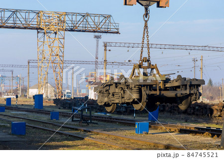 Railway depot stations with industrial crane that raises the driving wheels for train Railway depot stations with industrial crane that raises the driving wheels for train 84745521