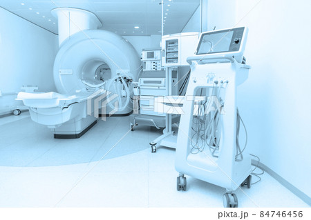 Medical CT or MRI Scan in the modern hospital laboratory. Interior of radiography department. Technologically advanced equipment in white room. Magnetic resonance diagnostics machine. Medical CT or MRI Scan in the modern hospital laboratory. Interior of radiography department. Technologically advanced equipment in white room. Magnetic resonance diagnostics machine. 84746456