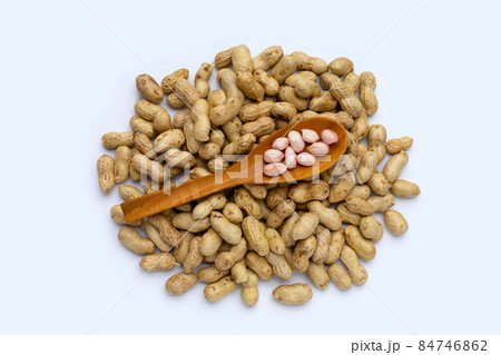Raw peanuts on white background. Raw peanuts on white background. 84746862