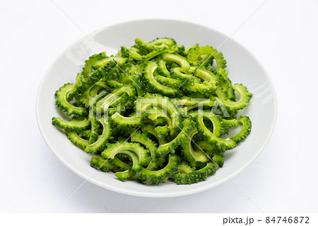 sliced bitter gourd on white background. 84746872