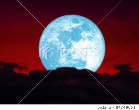 full harvest blue moon over dark heap cloud on night red sky full harvest blue moon over dark heap cloud on night red sky 84749051