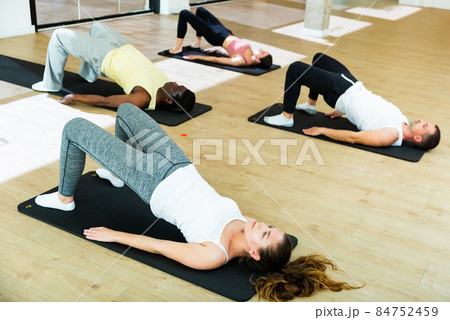 Sporty people practicing pilates at group class 84752459