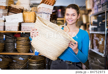 girl standing with wicker bag girl standing with wicker bag 84752973
