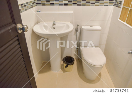 sanitary ware or toilet of a resort or hotel bathroom, white room and no one in the picture. 84753742