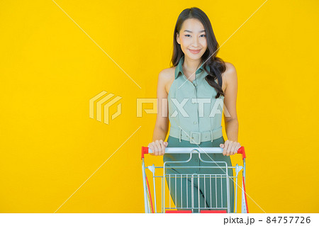 Portrait beautiful young asian woman smile with grocery basket 84757726