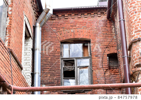 An old high-rise building built of red bricks. An old high-rise building built of red bricks. 84757978