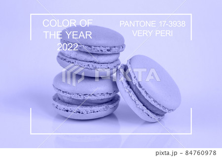 Sweet almond macaron or macaroon dessert cake colored in trendy color of year 2022 Very Peri background. Inspired by using color 17-3938. Color of the year concept Sweet almond macaron or macaroon dessert cake colored in trendy color of year 2022 Very Peri background. Inspired by using color 17-3938. Color of the year concept 84760978