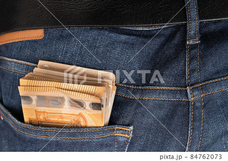 Euro banknotes in the pocket of jeans. Close up. To spend money Euro banknotes in the pocket of jeans. Close up. To spend money 84762073