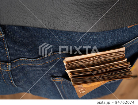 Euro banknotes in the pocket of jeans. Close up. To spend money Euro banknotes in the pocket of jeans. Close up. To spend money 84762074
