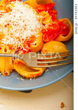 Italian snail lumaconi pasta with tomatoes Italian snail lumaconi pasta with tomatoes 84763963
