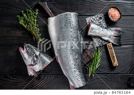 Raw cut salmon fish on a wooden cutting board...の写真素材 [84765164] - PIXTA