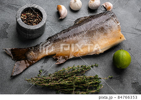 Smoked whole trout, on gray stone table background Smoked whole trout, on gray stone table background 84766353
