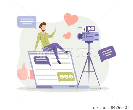 Smiling male vlogger shooting video camera sitting huge laptop talking greeting internet viewer Smiling male vlogger shooting video camera sitting huge laptop talking greeting internet viewer 84766482