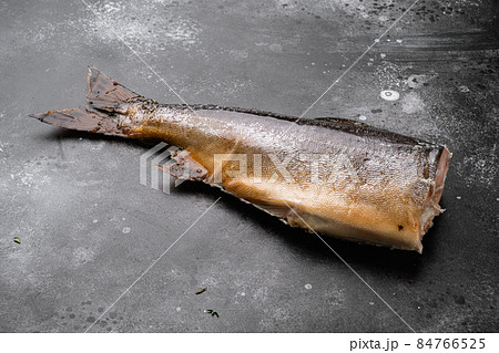 Smoked whole trout, on black dark stone table background, with copy space for text 84766525