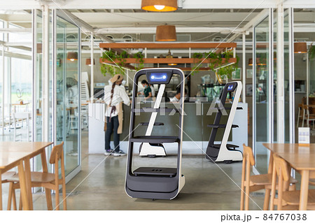 Autonomous waiter robot working in restaurant, Artificial intelligence 5G technology concept 84767038