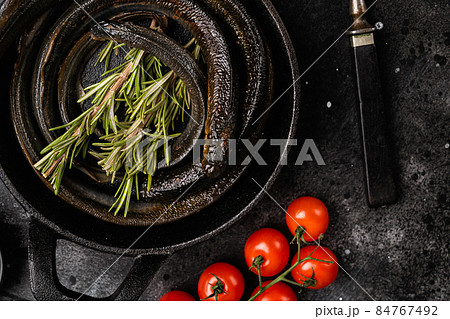 Smoked Lamprey seafood delicacy , on black wooden table background, top view flat lay 84767492