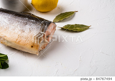 Cold smoked fish trout or salmon, on white stone table background, with copy space for text 84767494