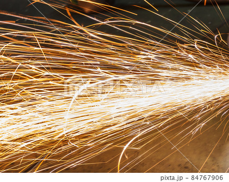 Metal in a factory grinding with sparks Metal in a factory grinding with sparks 84767906