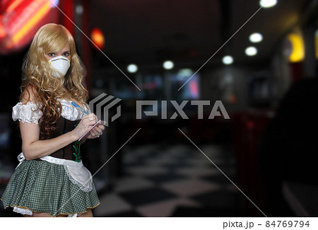 Waitress With Face Mask and Restaurant Background Waitress With Face Mask and Restaurant Background 84769794
