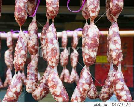 Chinese sausages hung up traditionally at a market stall. Chinese sausages hung up traditionally at a market stall. 84773220