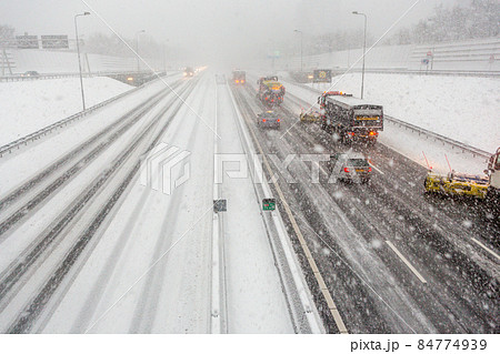 Snow shovels clean the A10 highway ring in Amsterdam during a heavy snow storm 84774939