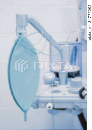 Blurred photo of the operating room in a hospital. Surgical equipment with operating table. Medical device for emergency patient in blue tone style. Blank Surgery Room. Clinic interior for background. Blurred photo of the operating room in a hospital. Surgical equipment with operating table. Medical device for emergency patient in blue tone style. Blank Surgery Room. Clinic interior for background. 84777002